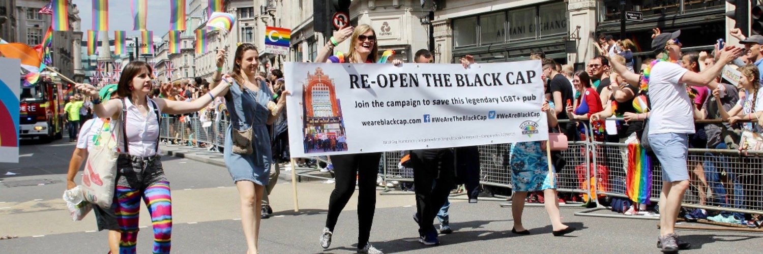 People walking in the Pride March supporting The Save The Black Cap Campaign